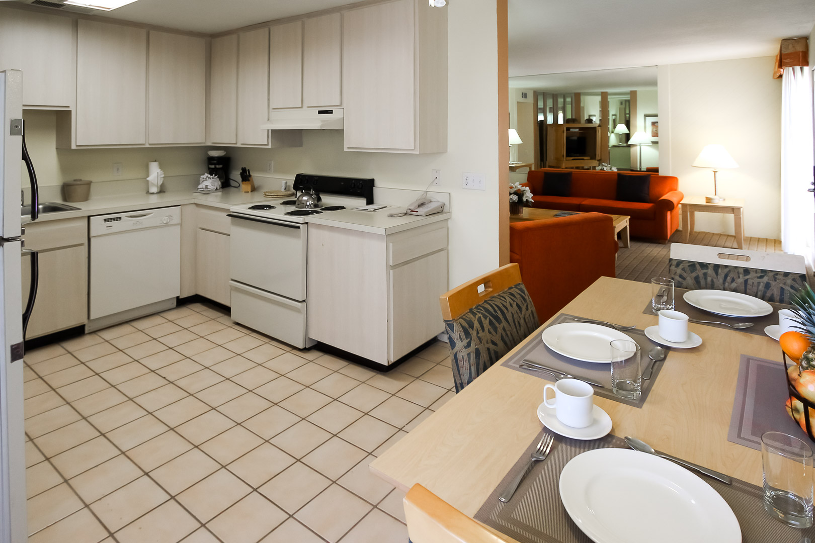 A clean kitchen area and dining table at VRI's Desert Vacation Villas in Palm Springs California.